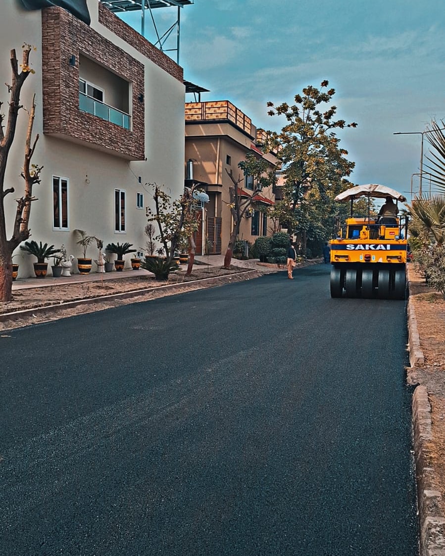 Asphalt is in progress in Phase-7 Hayatabad